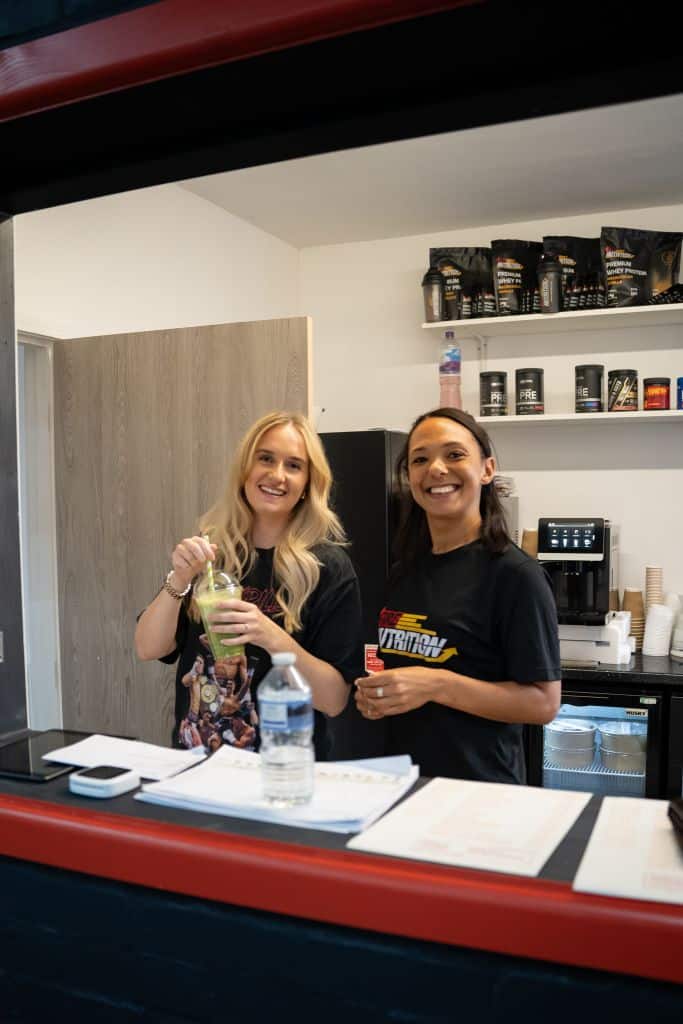 The girls serving protein shakes,