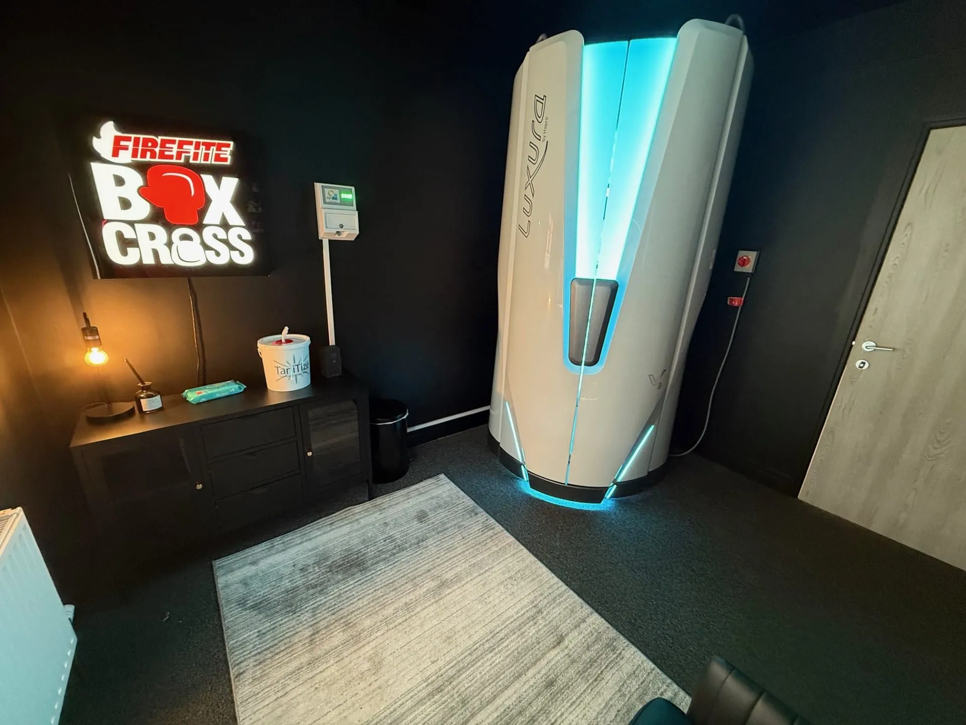 Stand-up sunbed at Boxcross UK tanning salon in Wisbech