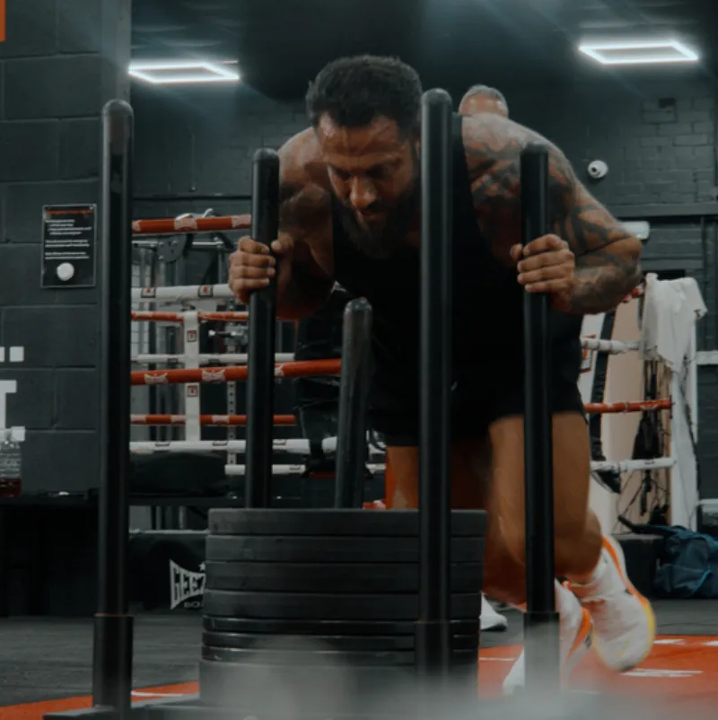 Athlete pushing a sled at Boxcross UK