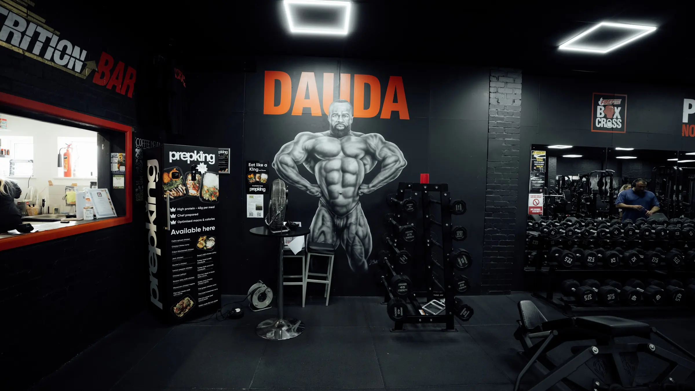 The nutrition bar hatch beneath the hand-painted Dauda mural