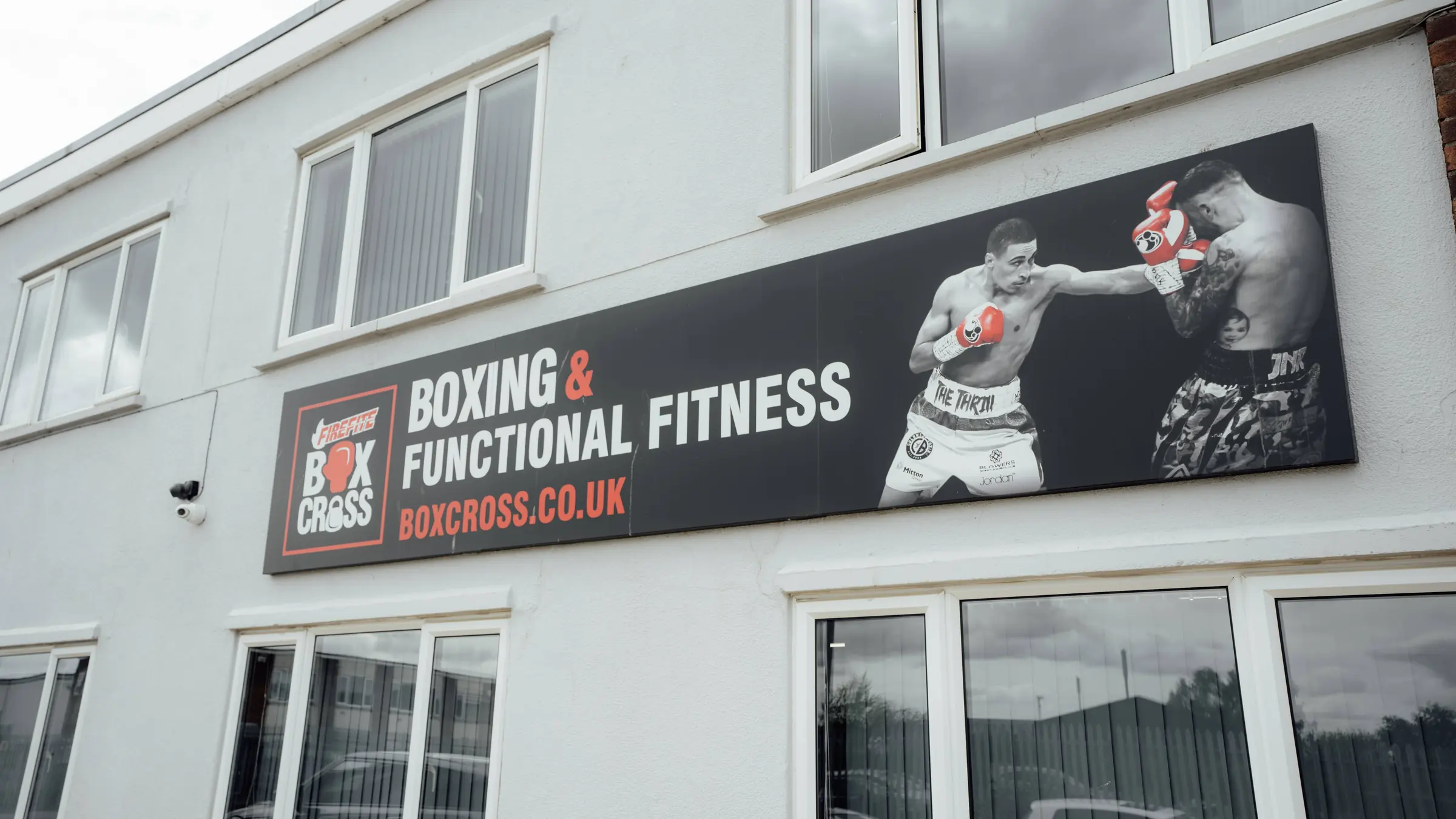 The Boxing and Functional Fitness sign on the front of the building on Regal Road