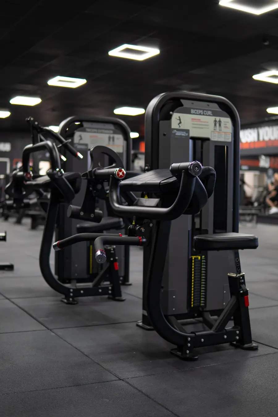 An empty row of resistance machines at a quiet hour