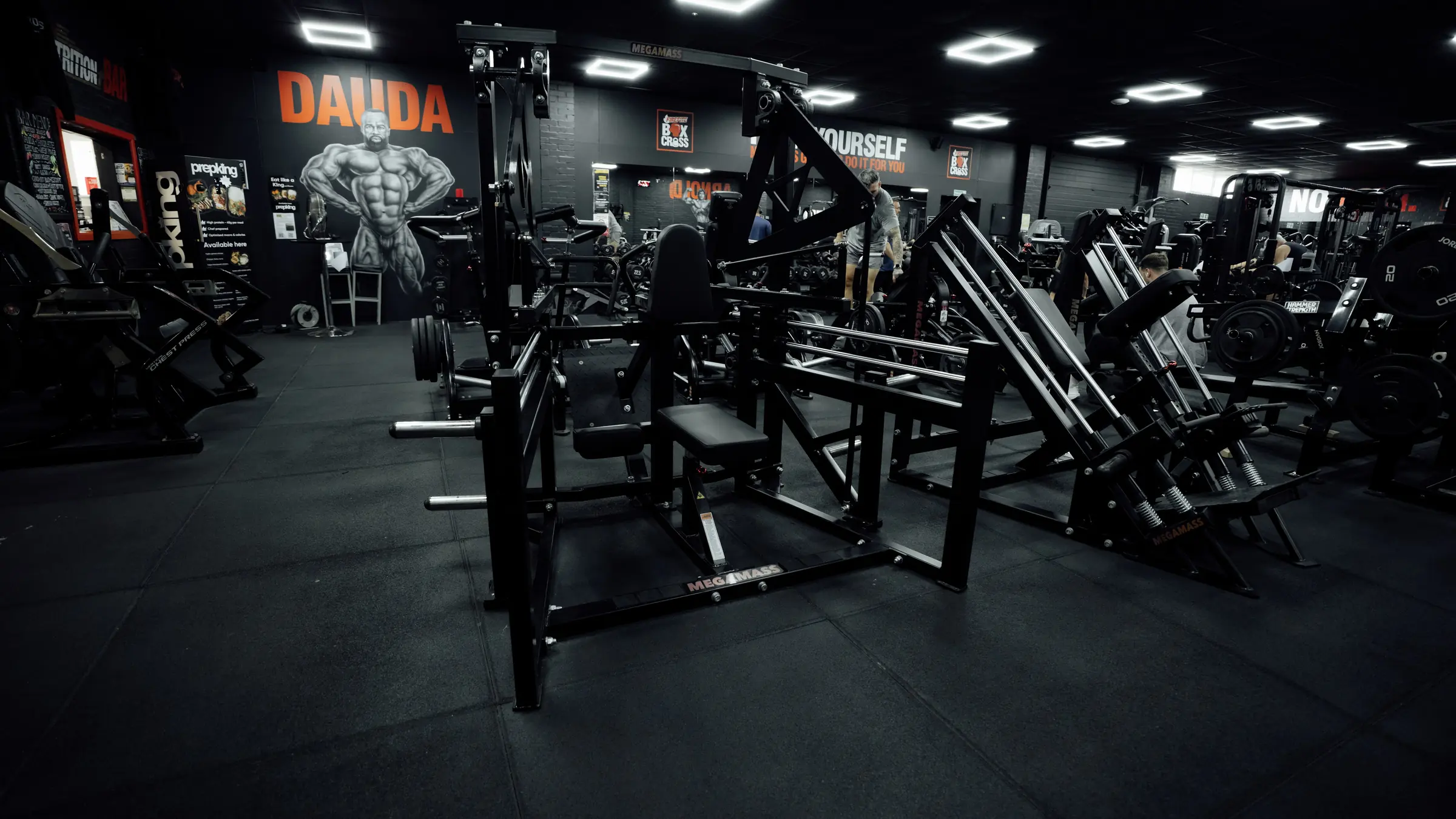 A row of Megamass plate-loaded machines in the machine room at BoxCross UK Wisbech