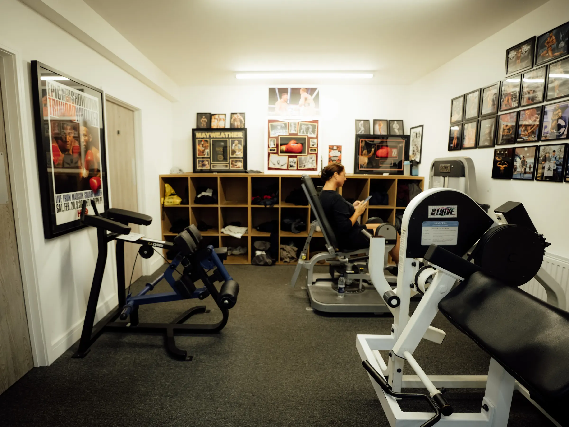 Inside the Recovery Hub at BoxCross UK, with kit lockers and boxing memorabilia