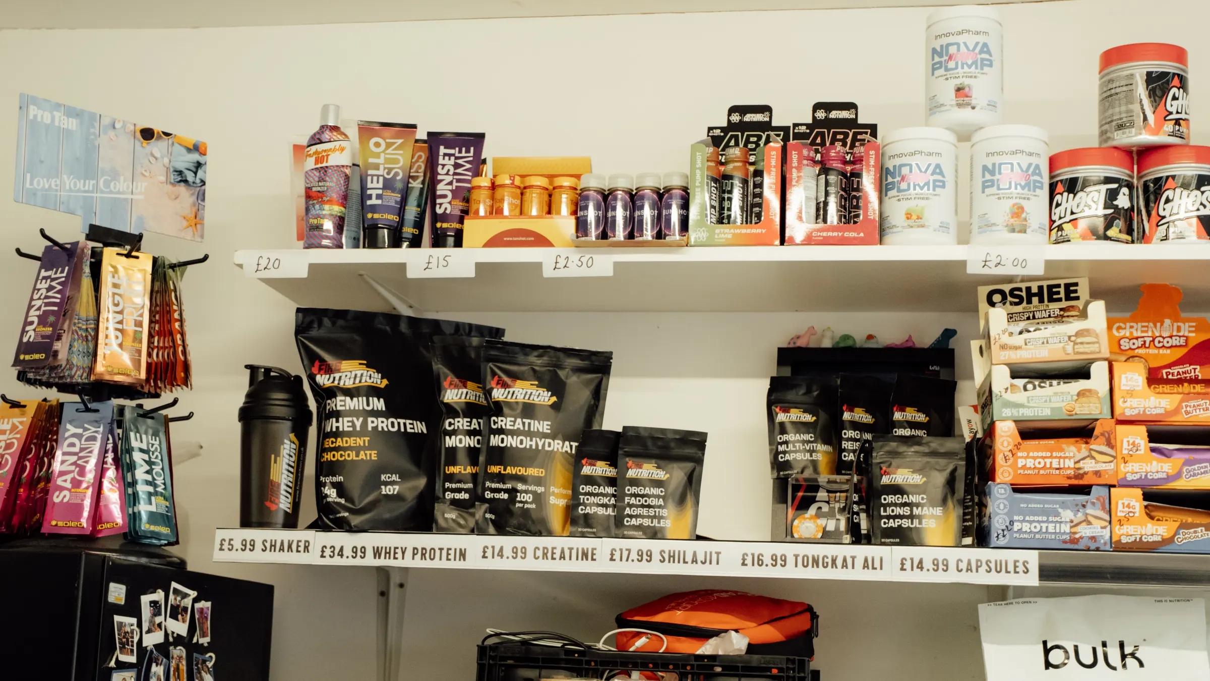 Whey protein, creatine and supplement bags on the shop shelf at BoxCross UK